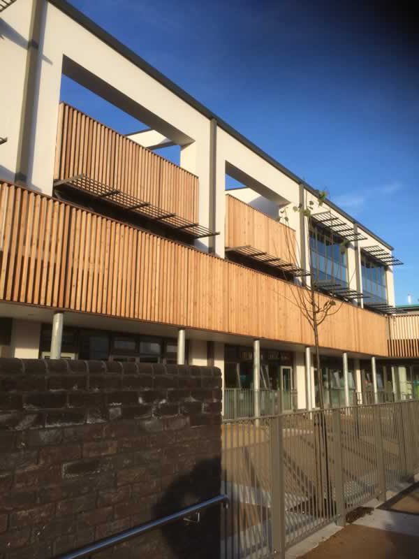 Commercial Carpentry Contractor Civitas Academy Cedar batten panel works